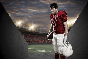 50884861 - football player with a red uniform on a tunnel to a stadium.
