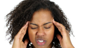 88131704 - frustrated black woman with headache isolated on white background