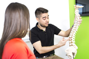 60270365 - a female patient describing talk to injury to osteopath