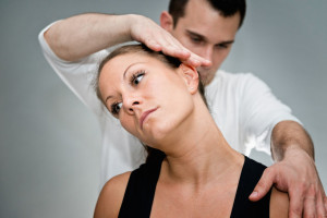 53709121 - chiropractic adjustment - chriopractor working on patient's neck